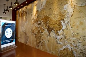 a large map of the world on a wall at Hotel LaCorte Prishtina in Pristina