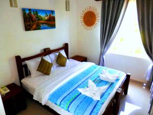 Postel nebo postele na pokoji v ubytování Hak Boutique Residence