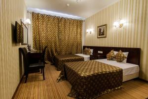 Voodi või voodid majutusasutuse Klassik Hotel toas