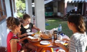 a group of three women sitting around a table at Parakum Rest Rooms in Polonnaruwa