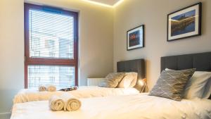 Posteľ alebo postele v izbe v ubytovaní City Center - Riverside by Apartmore