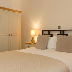 Кровать или кровати в номере Citystay - Mill Park Apartments