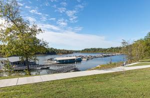 a river with a marina with boats in the water at Rough River Dam State Resort Park in Fentress McMahan