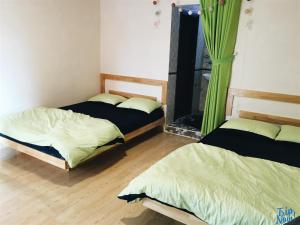 Postel nebo postele na pokoji v ubytování Homestay Hoang Vy