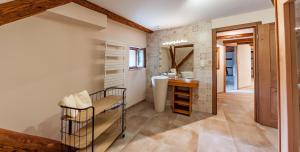 a bathroom with a sink and a mirror at Le gîte des Histoires in Kientzheim +79 photos