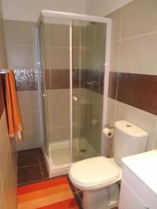 a bathroom with a toilet and a shower at Maison de l' Épicier in Funchal