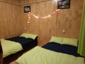 Postel nebo postele na pokoji v ubytování Homestay Hoang Vy