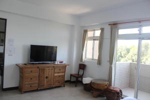 TV a/nebo společenská místnost v ubytování Shan Hu Lian Homestay
