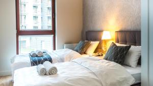 Posteľ alebo postele v izbe v ubytovaní City Center - Riverside by Apartmore