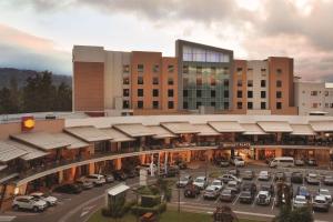 a rendering of a parking lot in front of a building at Hyatt Place San Jose Pinares in San José