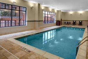 a swimming pool with blue water in a building at Hyatt Place Columbia/Downtown/The Vista in Columbia