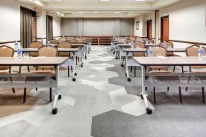 a large room with tables and chairs in it at Hyatt Place Memphis Primacy Parkway in Memphis