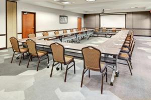 a large conference room with a large table and chairs at Hyatt Place Memphis Primacy Parkway in Memphis