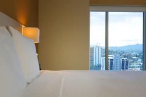 Ένα ή περισσότερα κρεβάτια σε δωμάτιο στο Hyatt Place Tegucigalpa