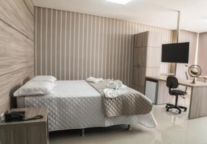 Hotel Imperador tesisinde bir odada yatak veya yataklar