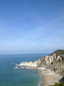 a view of the ocean and a rocky coastline at Old Vicarage Mortehoe Near Woolacombe 2 x sleeps 4 and 1 x sleeps 10 cottages in Mortehoe