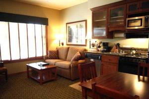 a living room with a couch and a table at Homestead Resort in Lynden