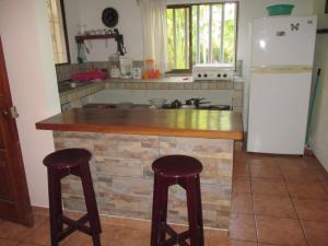 Køkken eller tekøkken på Pacific Jungle Condominium + 80 billeder