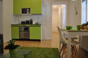 Kuchyň nebo kuchyňský kout v ubytování Studio Apartments City&style