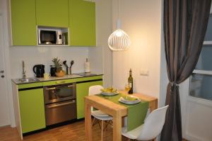 Kuchyň nebo kuchyňský kout v ubytování Studio Apartments City&style