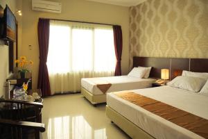 Voodi või voodid majutusasutuse Gerbera hotel toas