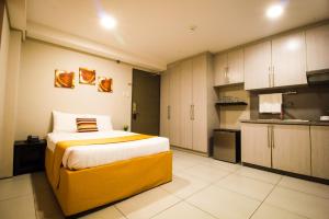 Kuchyň nebo kuchyňský kout v ubytování Jade Hotel and Suites