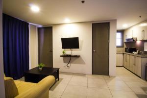 Kuchyň nebo kuchyňský kout v ubytování Jade Hotel and Suites