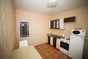 A kitchen or kitchenette at Apartments on Vesny