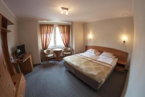 Cama o camas de una habitación en Hotel Sukiennice