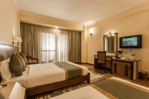 Katil atau katil-katil dalam bilik di Mount Kailash Resort