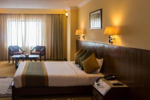Katil atau katil-katil dalam bilik di Mount Kailash Resort