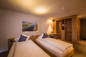 Postel nebo postele na pokoji v ubytování Hotel Frauenfeld