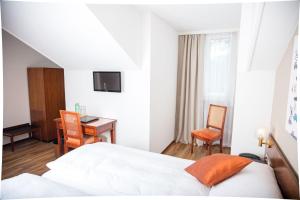 Postel nebo postele na pokoji v ubytování Hôtel de Chailly