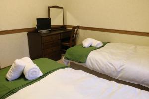 Postel nebo postele na pokoji v ubytování White Silver Hakuba
