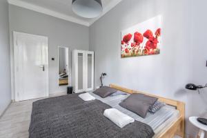 Posteľ alebo postele v izbe v ubytovaní Sereno Apartments