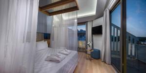 Postel nebo postele na pokoji v ubytování Dosinia Luxury Resort-Ultra All Inclusive