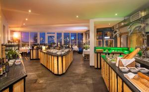 a restaurant with a view of the city at Sporthotel Cinderella in Obertauern