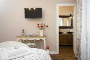 TV a/nebo společenská místnost v ubytování Magnolia St.Peter's Suites
