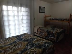 Кровать или кровати в номере Apart São Gabriel