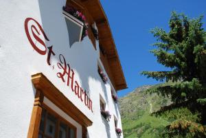 a sign on the side of a building at Apart Garni St Martin in Galtür