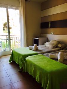 Postel nebo postele na pokoji v ubytování Hostal Termes