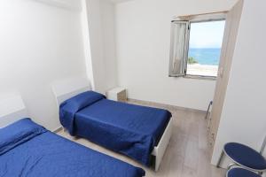 Postel nebo postele na pokoji v ubytování Camping Lido di Salerno + 10 fotografií