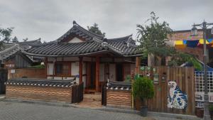 a small house with an asian roof at Nadle Bang in Jeonju