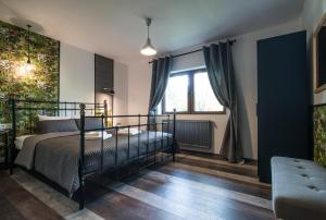 a bedroom with a bed and a window at Rent in Cluj Apartments in Cluj-Napoca