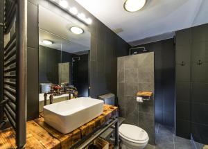 a bathroom with a sink and a toilet at Rent in Cluj Apartments in Cluj-Napoca +17 photos