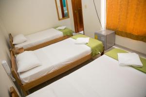 Ένα ή περισσότερα κρεβάτια σε δωμάτιο στο Hotel La Esperanza 2