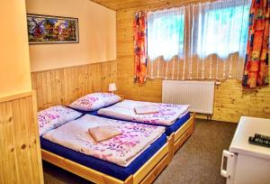 Postel nebo postele na pokoji v ubytování Penzion Radošov ubytování v soukromí