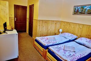 Postel nebo postele na pokoji v ubytování Penzion Radošov ubytování v soukromí