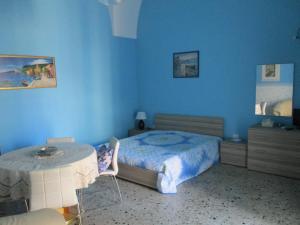 A bed or beds in a room at Azzurro Cielo