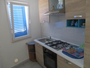 A kitchen or kitchenette at Azzurro Cielo